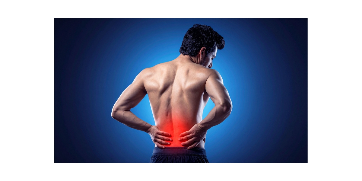 Man holding his low back due to chronic pain